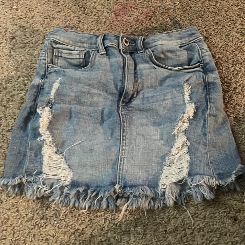 a denim skirt with rips